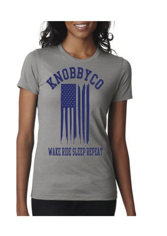 Women's Stone Gray American Flag Mountain Bike T-shirt. Wake. Ride. Sleep. Repeat.